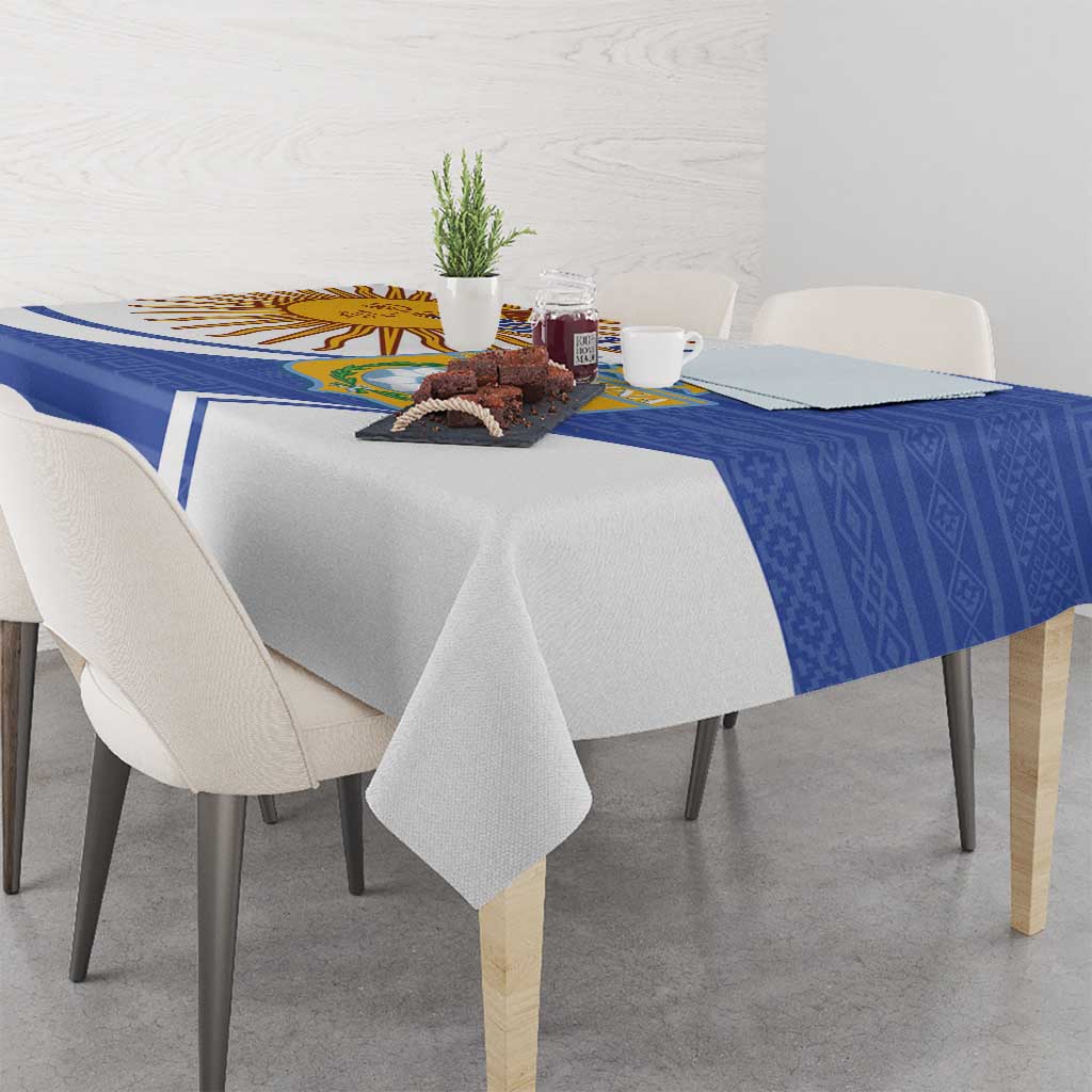 Navy and white Argentina tablecloth with diagonal border stripe and crest center