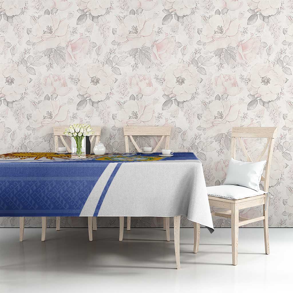 Navy and white tablecloth with Argentina crest and sun motif on dining setup