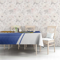 Navy and white tablecloth with Argentina crest and sun motif on dining setup