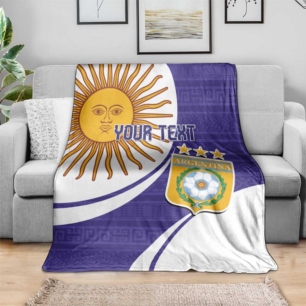 Purple and white Argentina football blanket draped over couch, sun face, crest, and Your Text