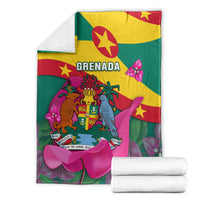Grenada flag blanket shown with folded white towels; vivid crest, birds, and pink flowers