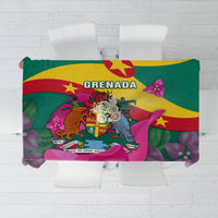 Green tablecloth with Grenada crest, flag colors, and bougainvillea floral print