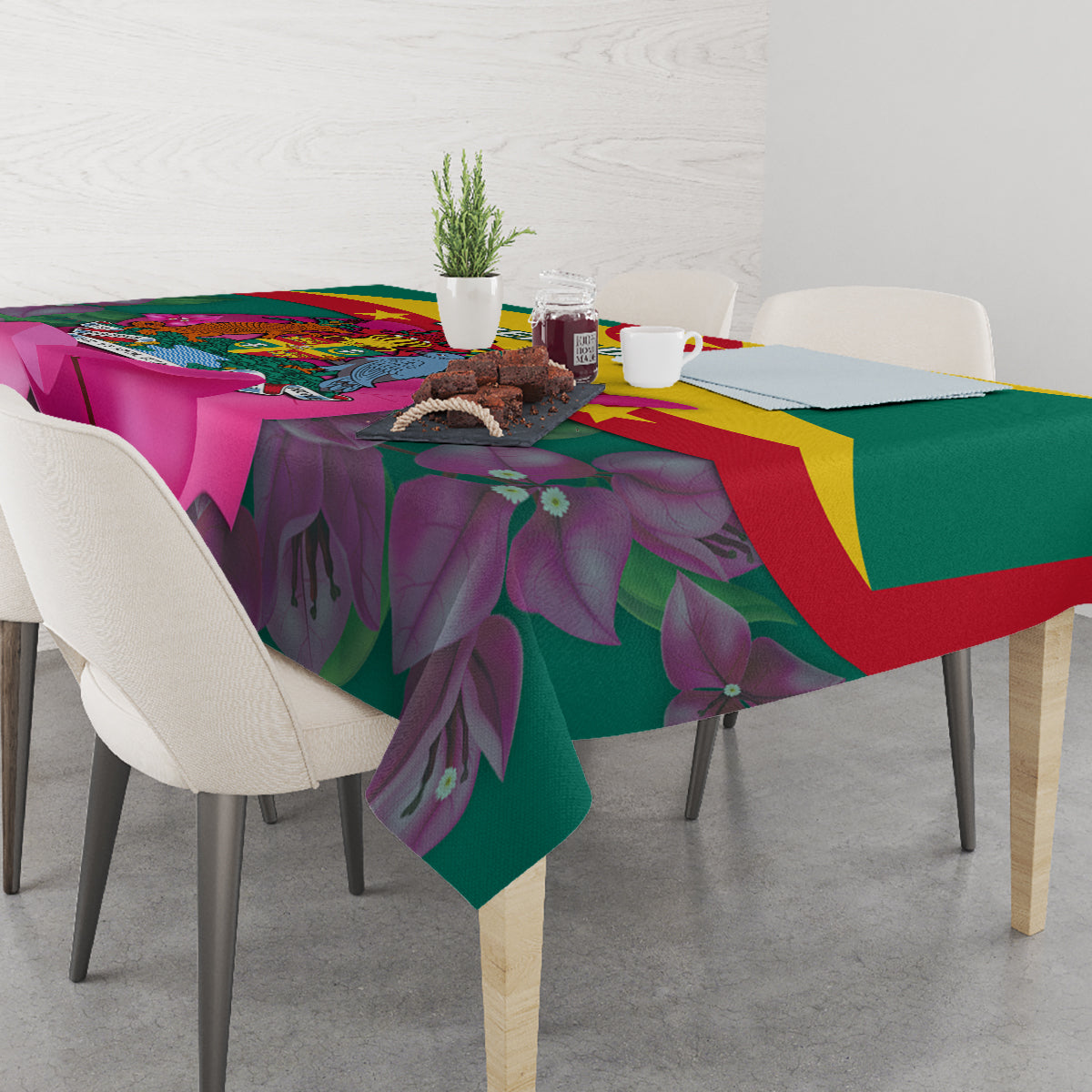 Green floral tablecloth with bougainvillea leaves and Grenada flag colors across top