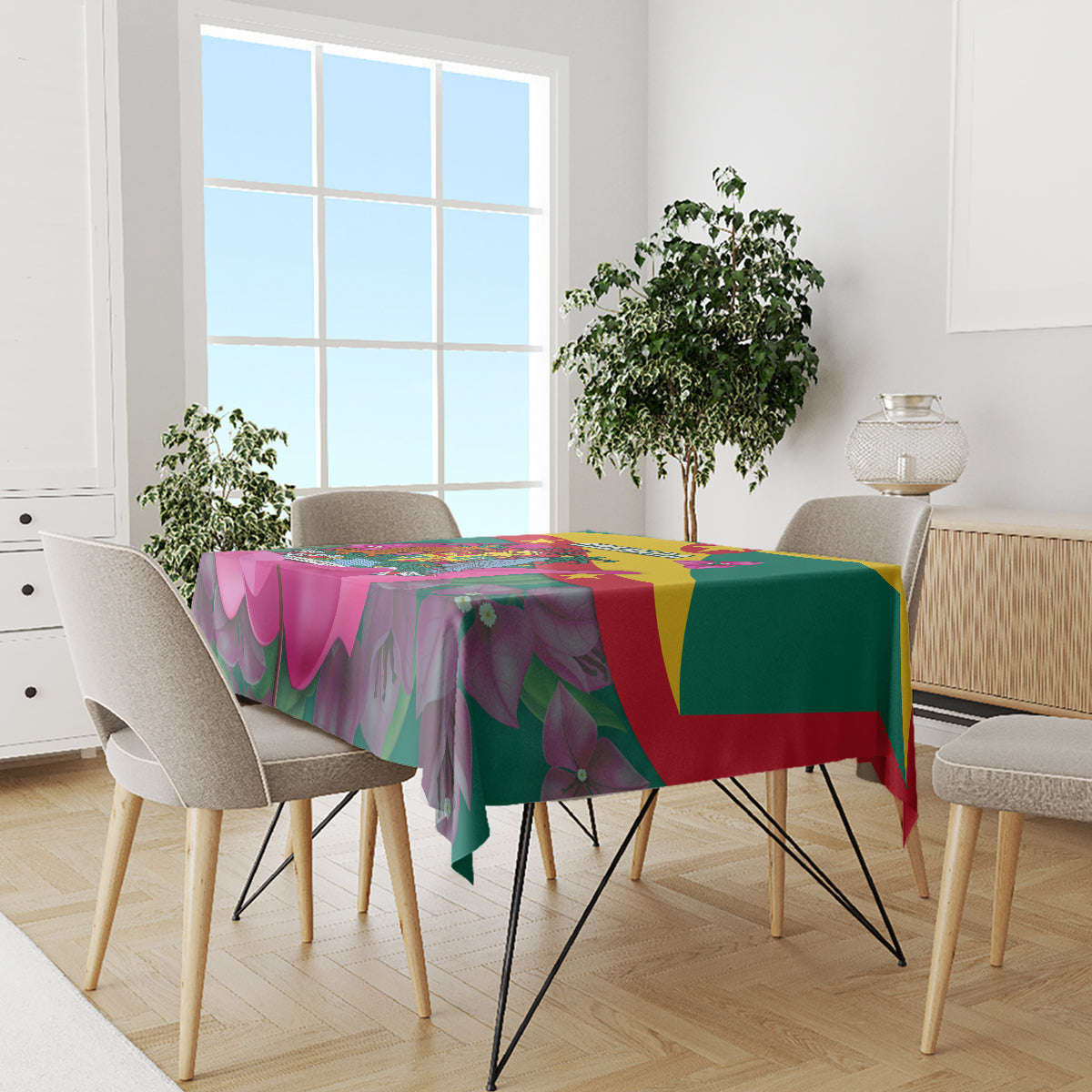 Green tablecloth featuring bougainvillea flowers and Grenada flag color blocks