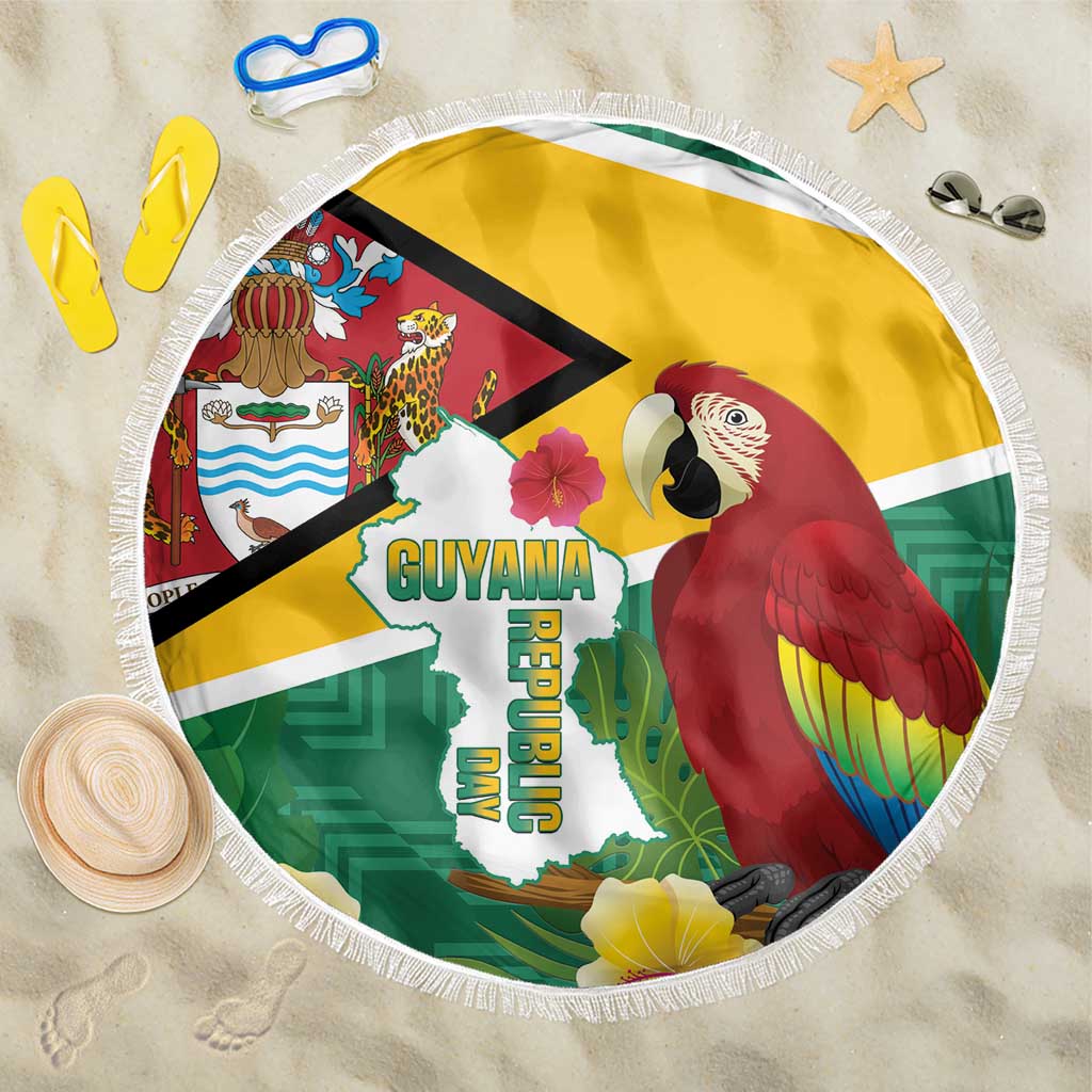 Round beach blanket with Guyana map graphic and red macaw, fringed edge