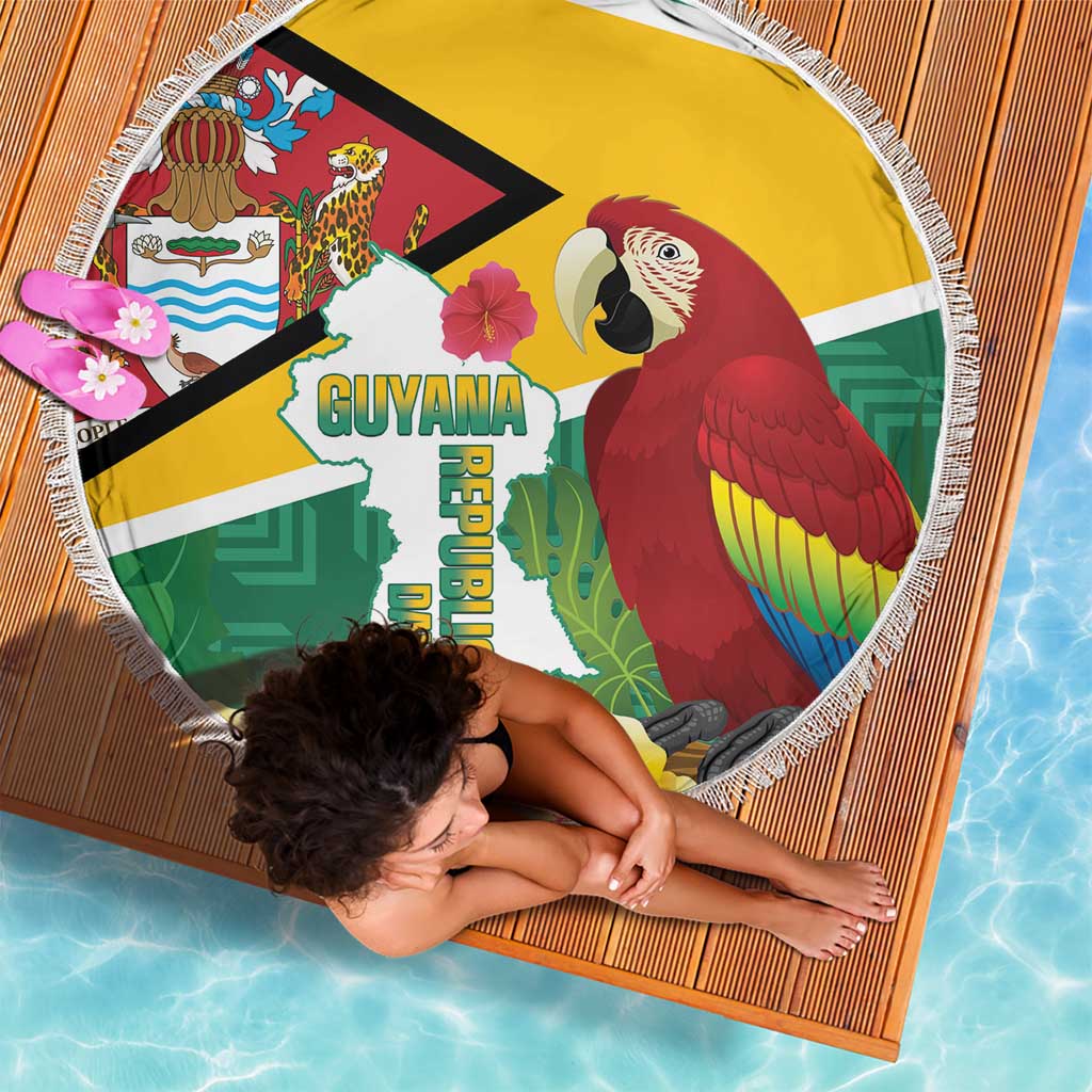 Round beach blanket showing Guyana map, red macaw, and colorful tropical icons