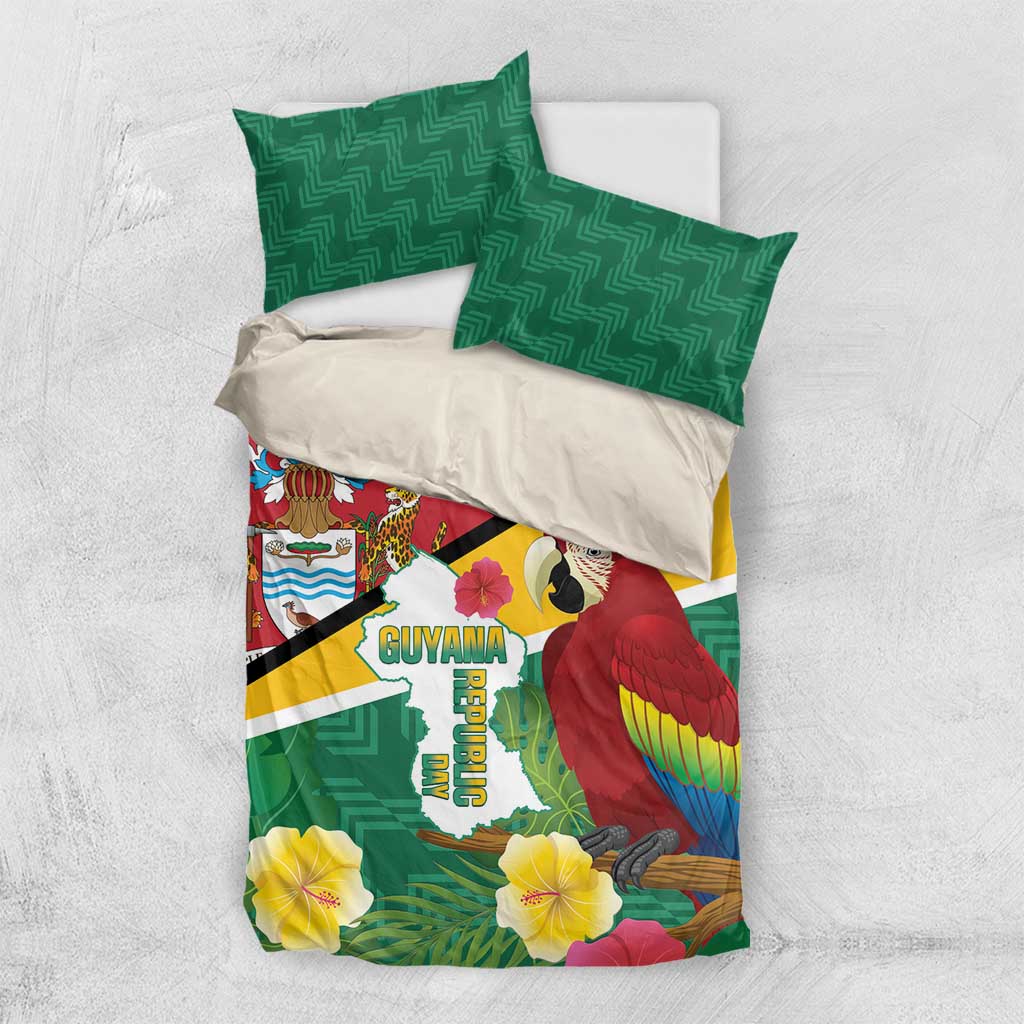 Guyana-themed bedding set laid flat: green pillows and tropical duvet with macaw and flowers