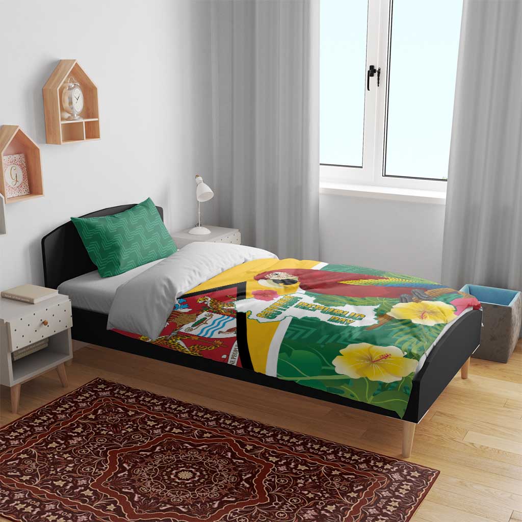 Tropical Guyana bedding set on bed with green pillows; duvet shows macaw and flag design