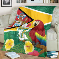 Tropical Guyana Republic Day blanket on sofa, scarlet macaw, Guyana text, and yellow flowers