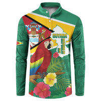 Green button henley sweatshirt with Guyana flag map, parrot graphic, tropical flowers