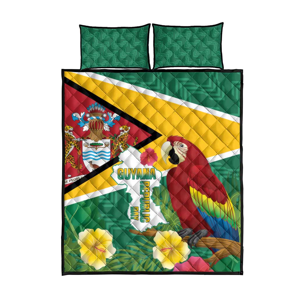 Green quilt bed set with Guyana flag graphic, macaw artwork, and two green pillows.