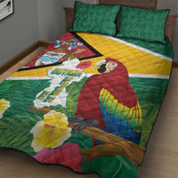 Green tropical quilt with macaw and flowers over Guyana map text; two green pillows.