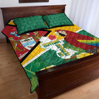 Green quilt bed set with Guyana map and parrot, with red and yellow stripe accents; two pillows.