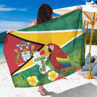 Green Guyana-themed sarong with macaw, flag colors, and tropical leaf print