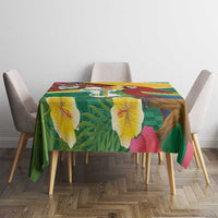 Rectangular tropical tablecloth in green with yellow edging and macaw and map artwork