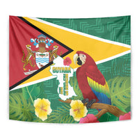 Guyana flag tapestry close-up with scarlet macaw, map text, and green patterned background