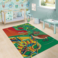 Green decorative area rug with colorful bird and dragon graphics and “Happy Mashramani” text