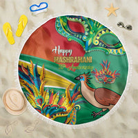 Round Mashramani beach blanket with green design, colorful bird and dragon, white fringe edge