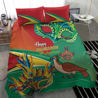 Green duvet bedding set with red pillowcases, colorful mask and bird design, printed lettering.