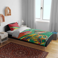 Bedding set with green duvet and red accent pillowcases featuring bird and mask artwork.