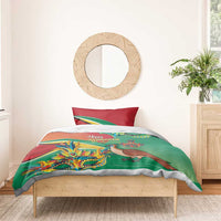 Bedding set with green duvet and red pillowcases, colorful bird and mask graphics with text.