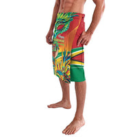 Men's printed swim shorts in red with green hem and colorful festival graphic