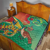 Green and red quilt spread on bed with bird and dragon mask graphic
