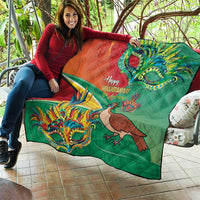 Green quilt draped on couch, with “Happy Mashramani” text, bird and mask art