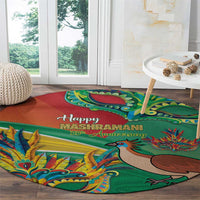 Round decorative carpet, green and orange with 'Happy Mashramani' text and colorful dragon artwork