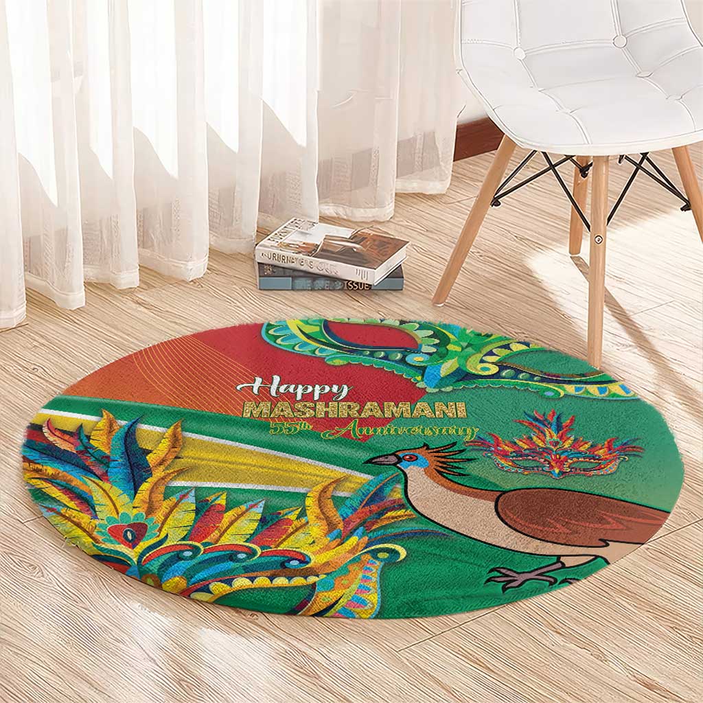 Round decorative carpet with green field and red-orange band, bird and floral motifs in bright colors