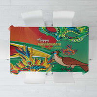 Green commemorative tablecloth with colorful bird and floral parade pattern