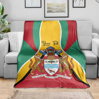 Guyana coat of arms personalized throw blanket with red, green, and yellow bands on sofa