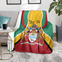 Guyana flag personalized blanket draped over gray chair, coat of arms crest visible