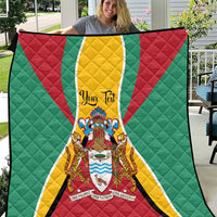 Quilt blanket in green, red, and yellow with Guyana crest center design