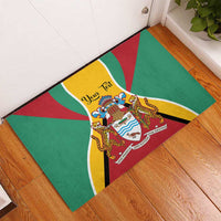 Green rubber doormat on wood floor with Guyana coat of arms and flag rays