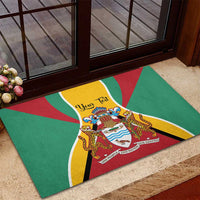 Green Guyana coat of arms rubber doormat on entryway steps with flag rays