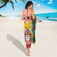 Guyana flag sarong in green, red, and yellow with coat-of-arms emblem, wrap style
