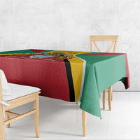 Guyana flag color tablecloth on wooden table with red center panel and green side panels