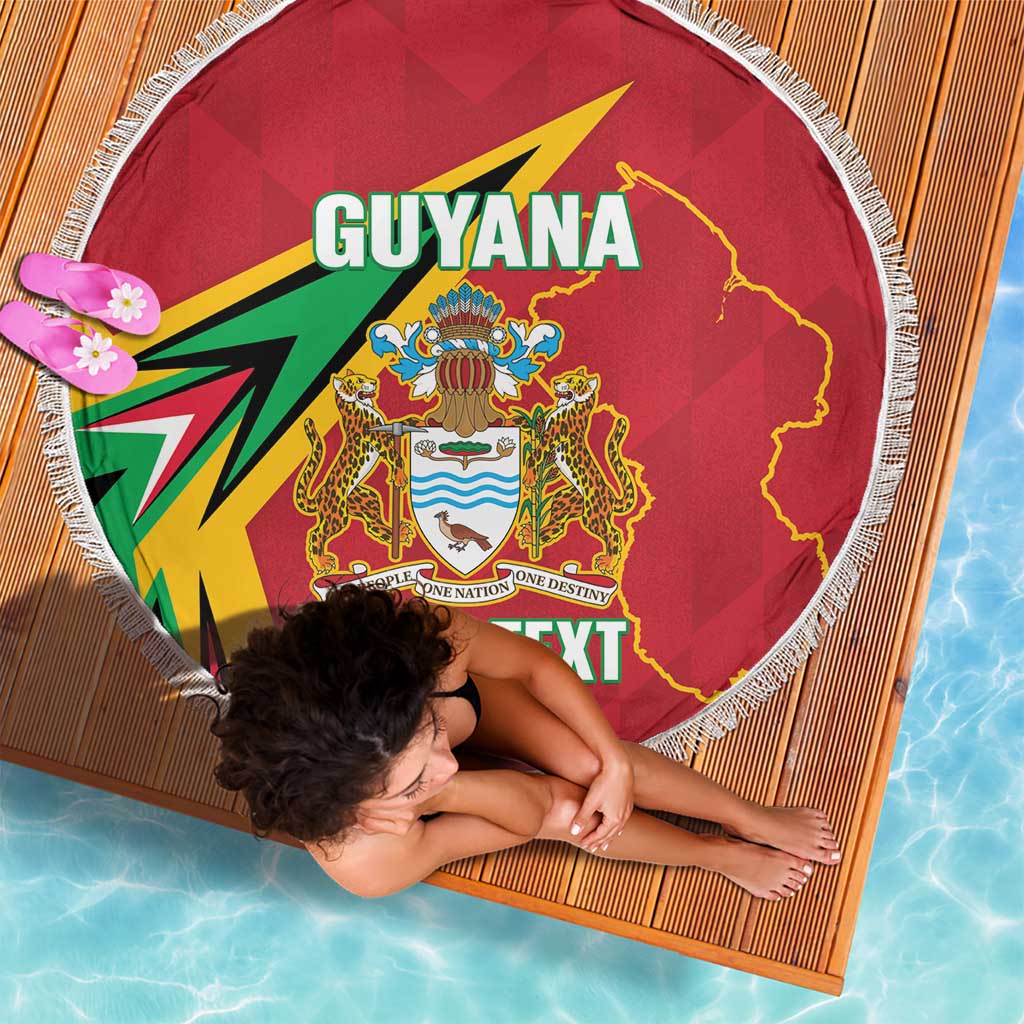 Red round beach blanket with fringe edge featuring Guyana crest, map outline, and 'YOUR TEXT'.