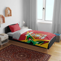Red Guyana duvet on bed with crest and map outline; green-yellow burst and custom text