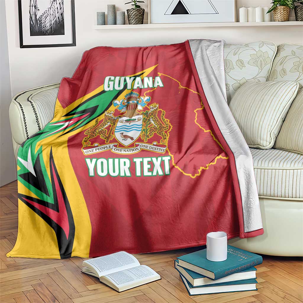 Red Guyana cricket blanket with crest and YOUR TEXT, draped on couch