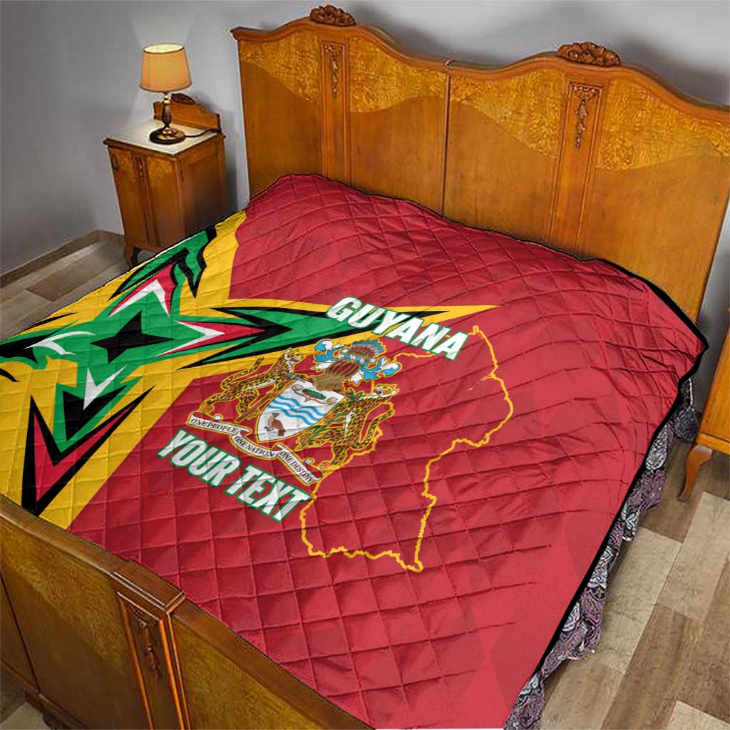 Red quilted bed throw with Guyana map, crest and starburst; custom text design