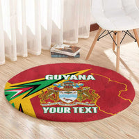 Red round carpet with Guyana crest and 'YOUR TEXT' lettering on light wood flooring