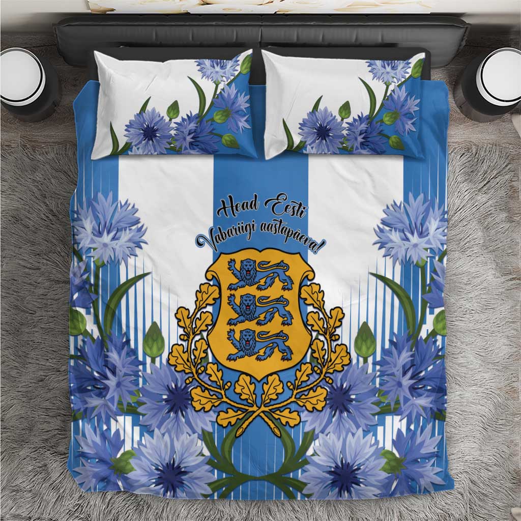 Blue bedding set with cornflower floral print, central crest, and two white pillowcases