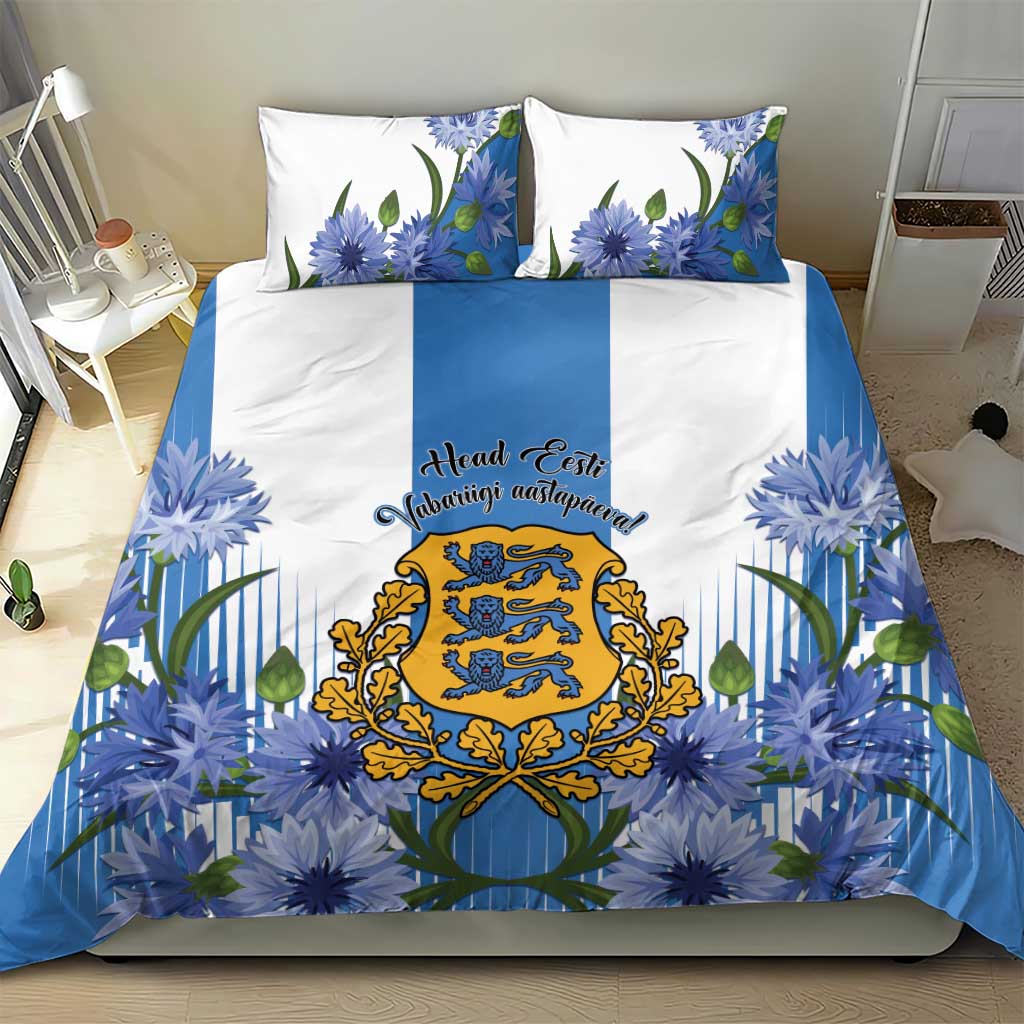 Blue duvet cover set with cornflower flowers and central crest, plus two matching pillowcases