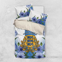 Blue bedding set shown folded: floral cornflower print duvet with matching pillowcases