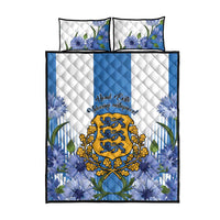 Quilt bed set, white quilt with blue panels, gold crest emblem, blue floral, two pillows