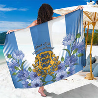 Blue Estonia-themed sarong with blue floral pattern and golden coat-of-arms crest