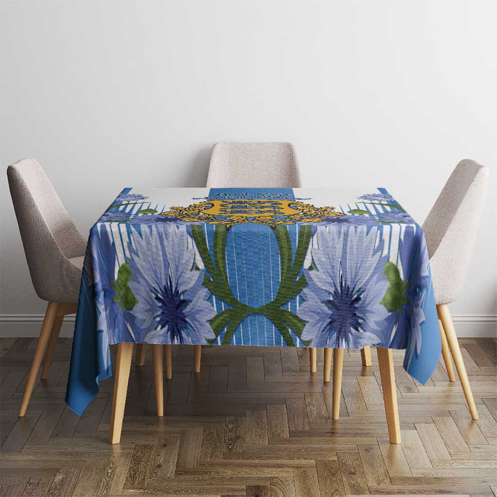 Blue tablecloth with crest center and large blue flower print on dining table