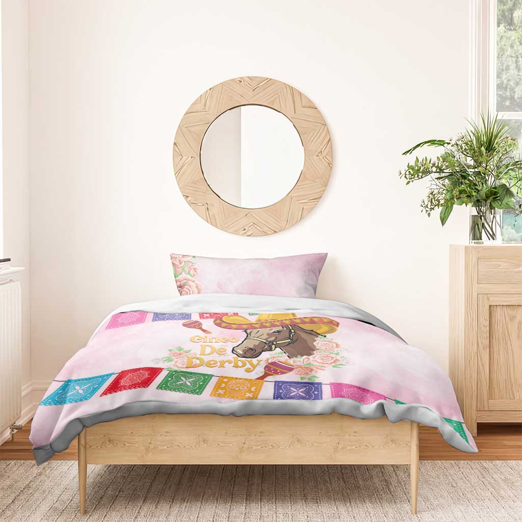 Pink bedding set with horse graphic, sombrero hat, roses, and multicolor patterned trim